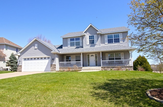 traditional home featuring a garage, covered porch, a front lawn, and stone siding