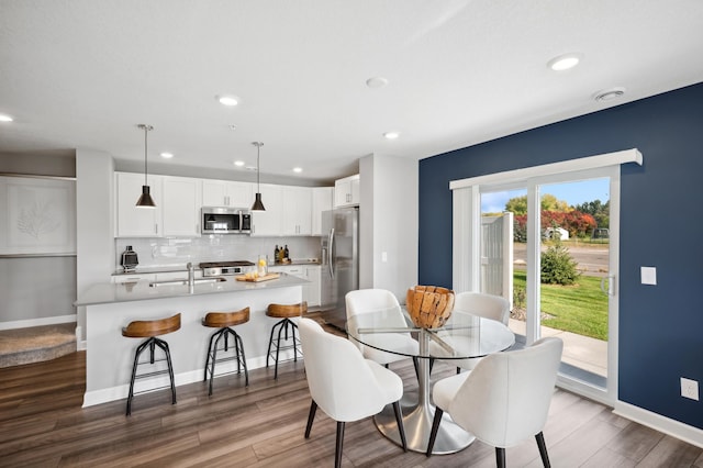 1083 151st St W, Rosemount, MN 55068 - dining space featuring dark wood-type flooring, recessed lighting, and baseboards