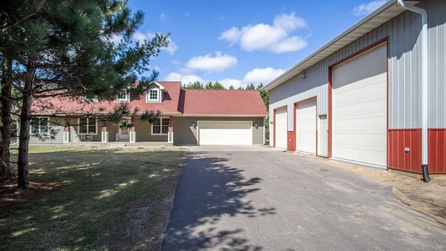 view of front of home featuring aphalt driveway