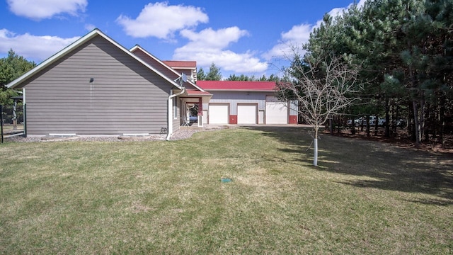 exterior space with a yard and a garage