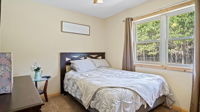bedroom with carpet floors, baseboards, and ceiling fan