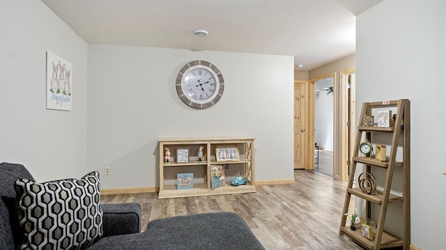 interior space with wood finished floors and baseboards