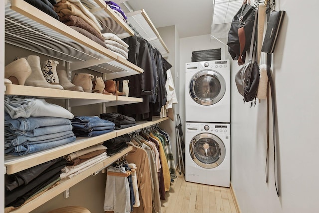 3104 Lake St Unit 410, Minneapolis, MN 55416 - laundry area featuring stacked washer / dryer and wood finished floors