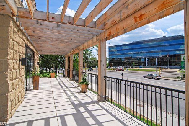 3104 Lake St Unit 410, Minneapolis, MN 55416 - porch featuring a pergola