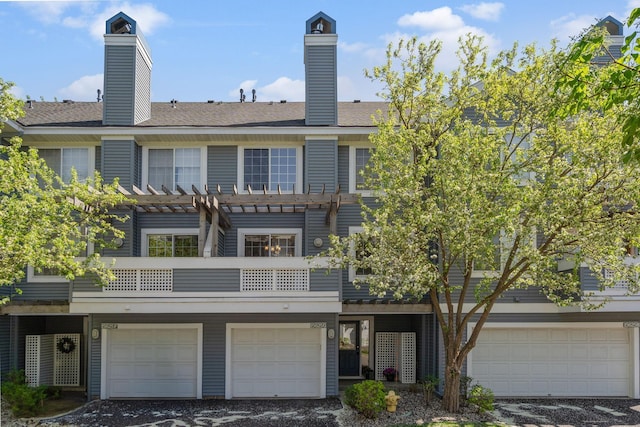 15625 24th Ave N Unit G, Plymouth, MN 55447 - multi unit property with an attached garage, a chimney, a pergola, and a balcony