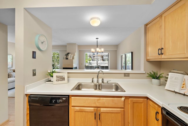 15625 24th Ave N Unit G, Plymouth, MN 55447 - kitchen featuring black dishwasher, a sink, light countertops, a chandelier, and a peninsula