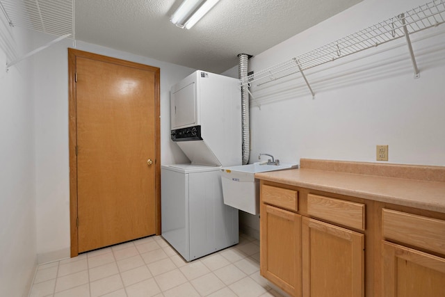 15625 24th Ave N Unit G, Plymouth, MN 55447 - laundry room featuring stacked washing machine and dryer and cabinet space
