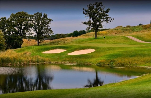 view of community with a water view and view of golf course