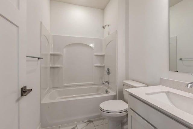 bathroom featuring washtub / shower combination, toilet, marble finish floor, and vanity