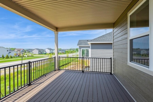 wooden deck with a residential view