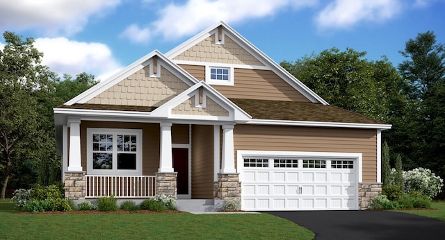 craftsman-style house featuring stone siding, a front lawn, aphalt driveway, a garage, and covered porch