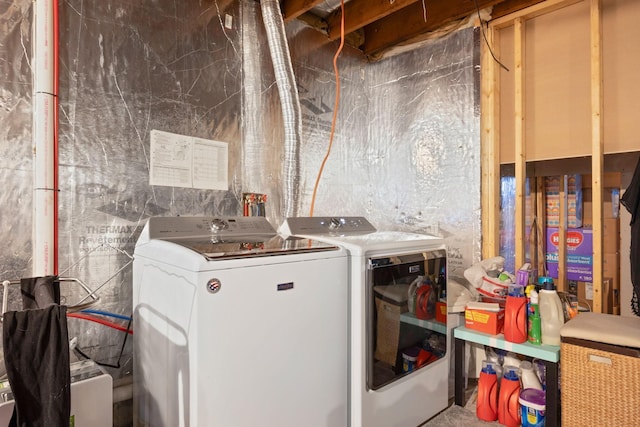 laundry area with washing machine and dryer
