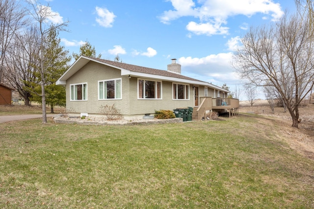 view of side of property with a yard, a deck, a chimney, and stairs