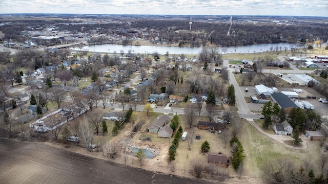 drone / aerial view featuring a water view and a residential view