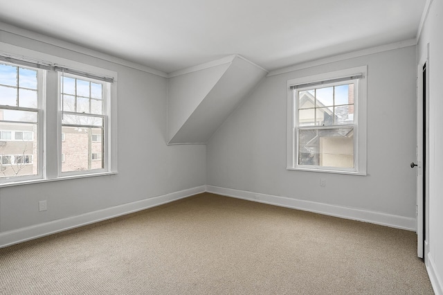 additional living space with carpet, baseboards, and a healthy amount of sunlight