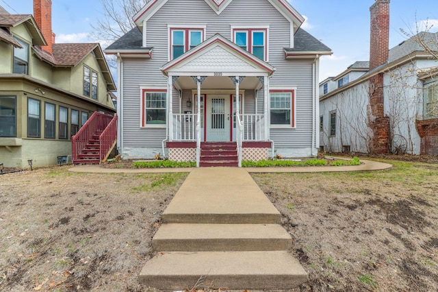 view of front facade with covered porch and stairs