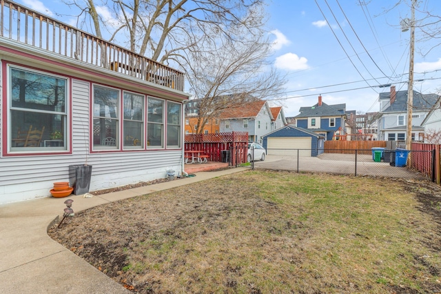 view of yard featuring a fenced backyard and a residential view