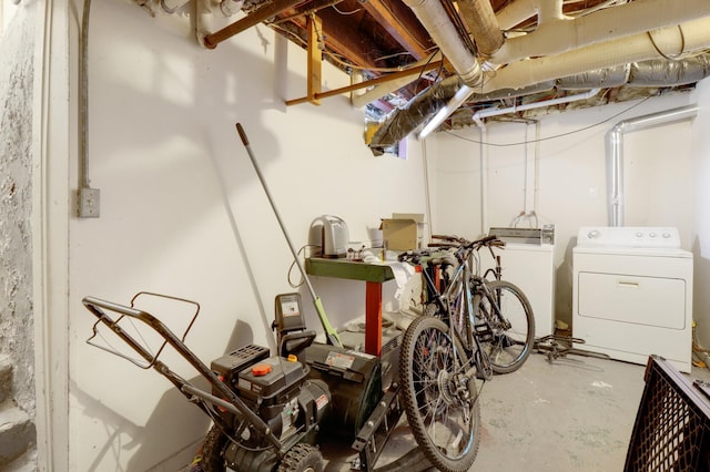 unfinished basement featuring washer and clothes dryer