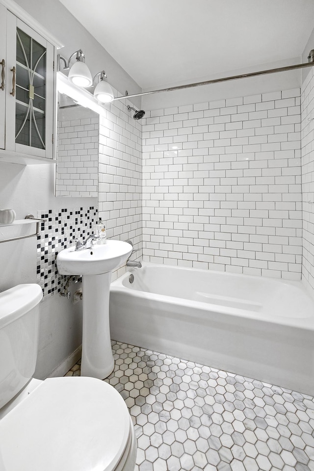 full bath with toilet and  shower combination
