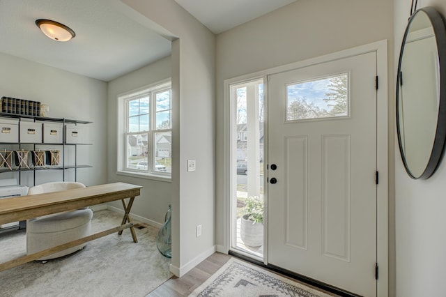 11422 34th St N, Lake Elmo, MN 55042 - foyer featuring baseboards and light wood-style floors