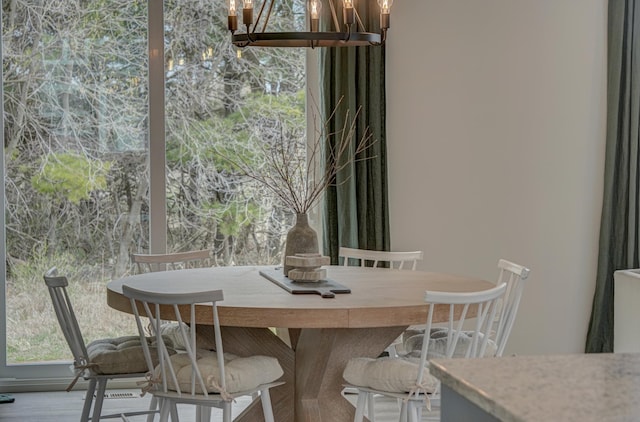 11422 34th St N, Lake Elmo, MN 55042 - dining space featuring a chandelier