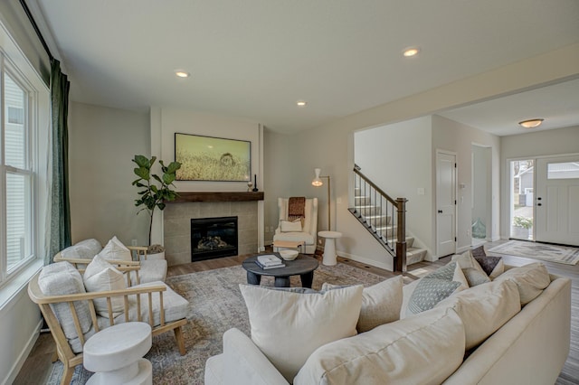 11422 34th St N, Lake Elmo, MN 55042 - living room featuring wood finished floors, stairs, healthy amount of natural light, baseboards, and recessed lighting