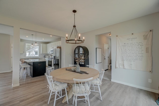 11422 34th St N, Lake Elmo, MN 55042 - dining space featuring a chandelier, light wood-type flooring, baseboards, and recessed lighting