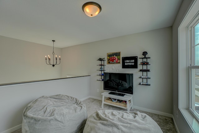 11422 34th St N, Lake Elmo, MN 55042 - living area featuring carpet floors, a chandelier, baseboards, and healthy amount of natural light
