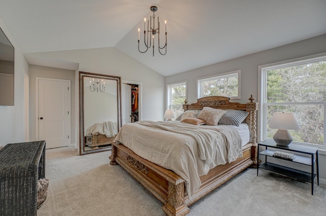 11422 34th St N, Lake Elmo, MN 55042 - bedroom featuring a chandelier, light colored carpet, vaulted ceiling, a spacious closet, and a closet