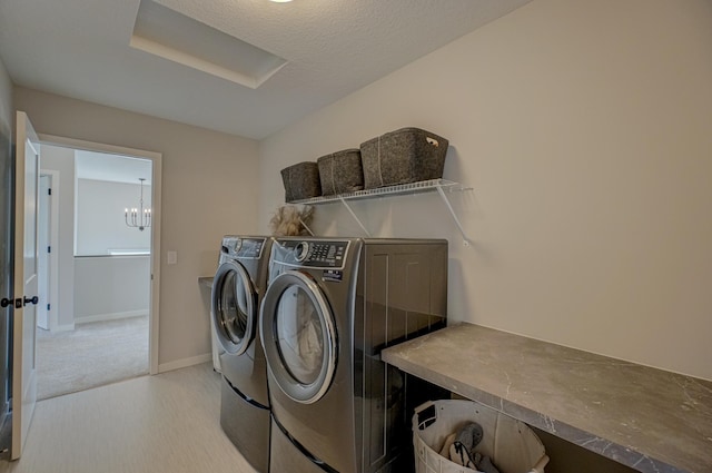 11422 34th St N, Lake Elmo, MN 55042 - laundry room with washing machine and clothes dryer, baseboards, and light carpet