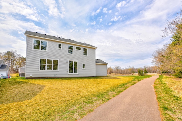 11422 34th St N, Lake Elmo, MN 55042 - back of house featuring a lawn and central AC unit