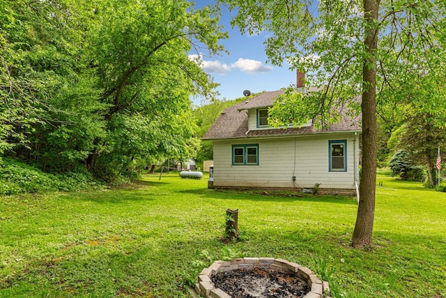 32673 Rosewood Ln, Saint Peter, MN 56082 - view of grassy yard featuring a fire pit
