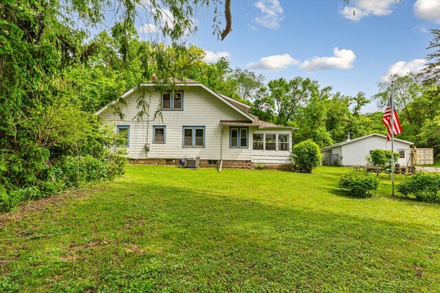 32673 Rosewood Ln, Saint Peter, MN 56082 - back of house featuring central AC and view of wooded area