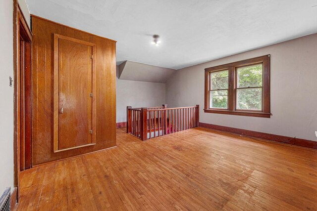 32673 Rosewood Ln, Saint Peter, MN 56082 - spare room with hardwood / wood-style floors, vaulted ceiling, and baseboards