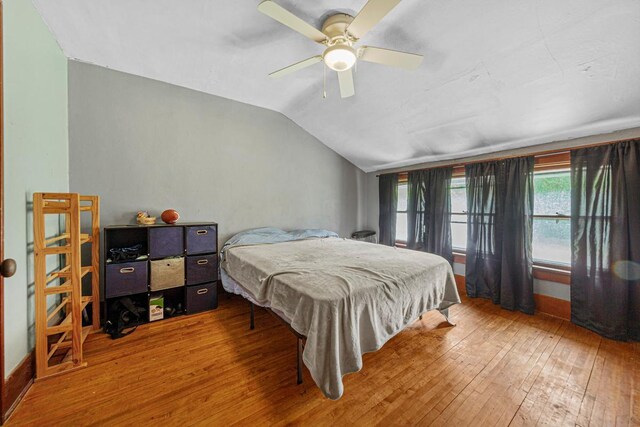 32673 Rosewood Ln, Saint Peter, MN 56082 - bedroom with hardwood / wood-style floors, vaulted ceiling, and a ceiling fan