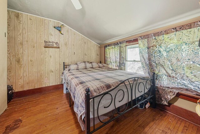 32673 Rosewood Ln, Saint Peter, MN 56082 - bedroom with wood walls, lofted ceiling, hardwood / wood-style floors, and a ceiling fan