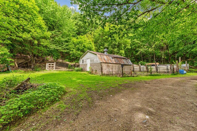 32673 Rosewood Ln, Saint Peter, MN 56082 - view of yard with an outbuilding and a forest view