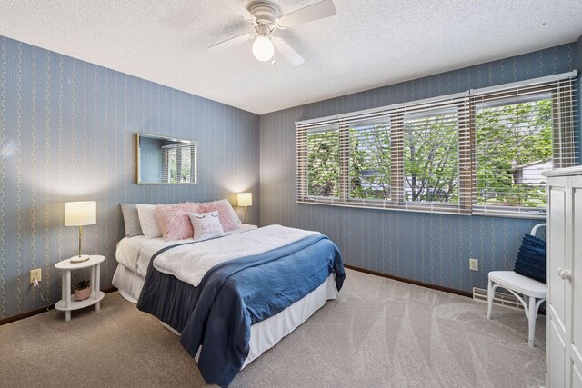 14704 Glendale Ave SE, Prior Lake, MN 55372 - bedroom with carpet, multiple windows, a textured ceiling, a ceiling fan, and wallpapered walls