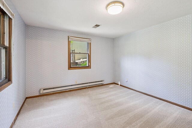 14704 Glendale Ave SE, Prior Lake, MN 55372 - carpeted spare room with baseboard heating and wallpapered walls