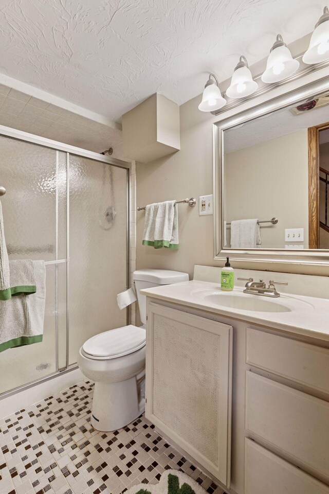14704 Glendale Ave SE, Prior Lake, MN 55372 - full bath featuring vanity, a shower stall, toilet, and a textured ceiling