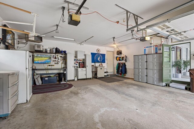 14704 Glendale Ave SE, Prior Lake, MN 55372 - garage featuring a garage door opener and freestanding refrigerator