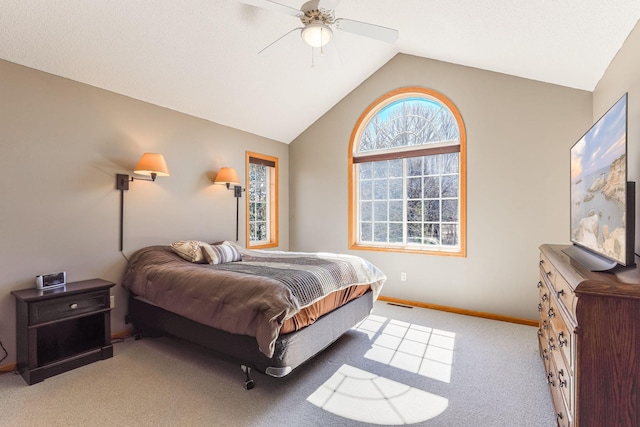 bedroom featuring baseboards, vaulted ceiling, a ceiling fan, visible vents, and carpet