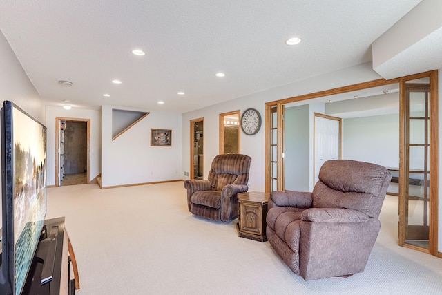 living room with baseboards, recessed lighting, and light colored carpet