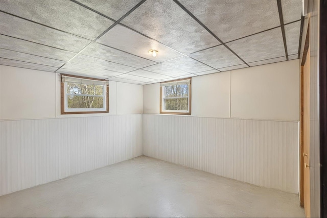 basement featuring wainscoting