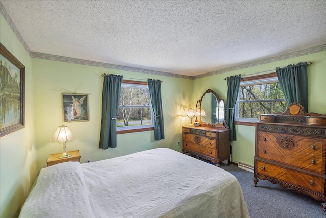 bedroom featuring a textured ceiling, carpet, multiple windows, and baseboard heating