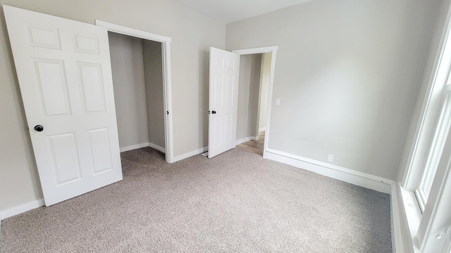 1023 17th Ave SE, Minneapolis, MN 55414 - unfurnished bedroom with carpet floors and baseboards