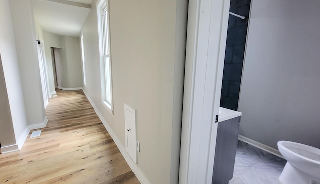 1023 17th Ave SE, Minneapolis, MN 55414 - hallway featuring baseboards and light wood-style floors