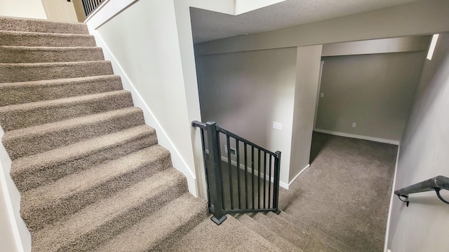 1023 17th Ave SE, Minneapolis, MN 55414 - stairway with carpet flooring and baseboards