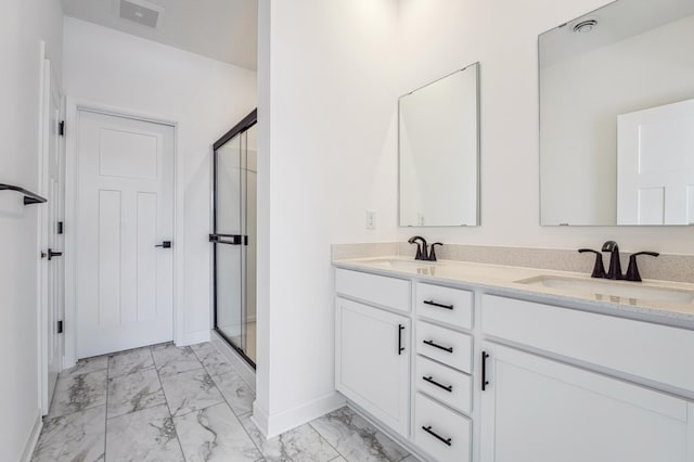 bathroom featuring marble finish floor, visible vents, a sink, baseboards, and a stall shower