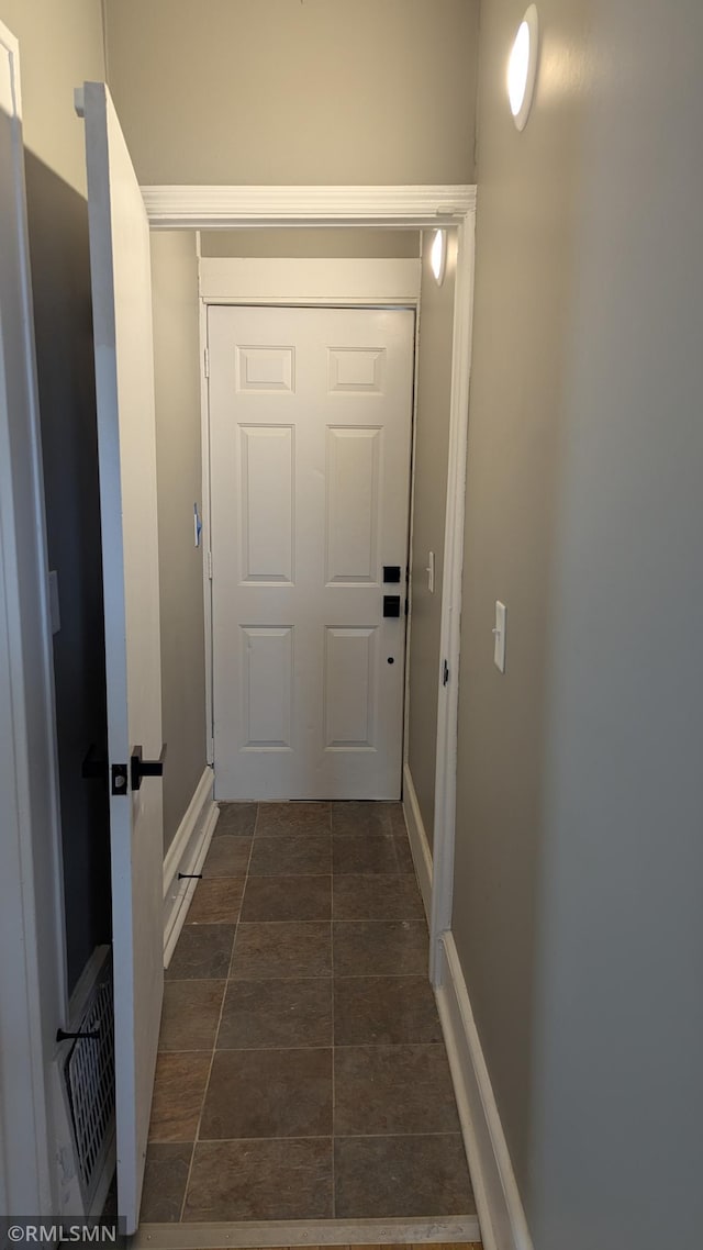 3454 Newton Ave N, Minneapolis, MN 55412 - doorway featuring baseboards and dark stone finish floors
